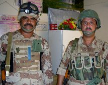 The Iraqi platoon sergeant poses with one of the Iraqi medics.