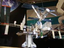 This is a model of the space station that is currently under construction in space, as it appears at this time. It will be about three times this size when completed. Note the shuttle that is attached to the station.