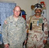 SFC Wood posing with the Iraqi platoon sergeant.