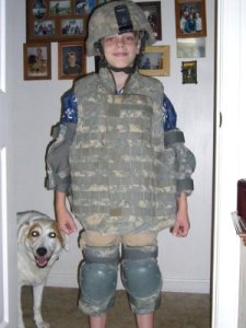 Son Nathan tries on dad's body armour.