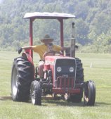 Our main taks was mowing the field. In this case our grandson was assisting.