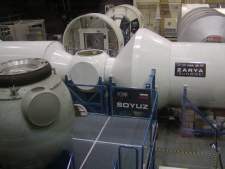 Mock-ups of the new space station occupy the major share of the lab. These sections are of the portion of the station built by Russia.