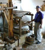 Kirk works as miller for the restored grist mill.