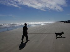 Pam and Muffie walk the beach at Quintana Co. Park.
