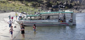 Our tour boat stops for a rest break on a small Snake River beach.